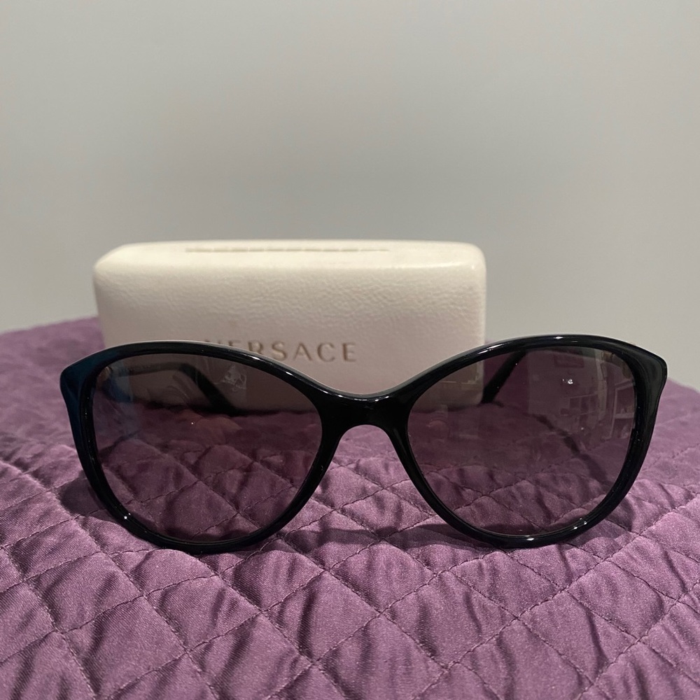 Slightly used Versace sunglasses with case.